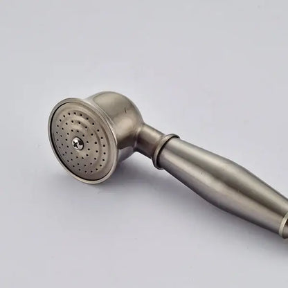 Antique brass and chrome hand shower head with stainless steel brushed finish and circular perforated spray face