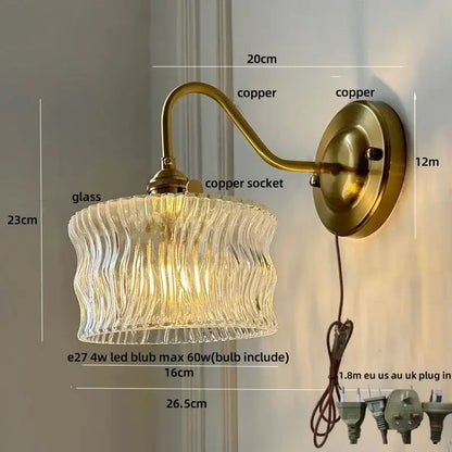 Antique brass wall sconce with clear glass textured with wavy vertical ridges by decorbites clear glass for bedroom lighting