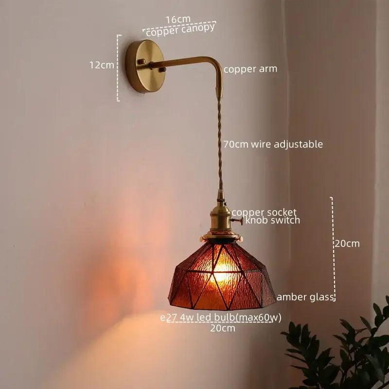Antique brass wall lamp with amber stained glass shade and adjustable wire arm for decorbites led bedroom sconce