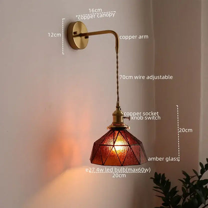 Antique brass wall lamp with amber stained glass shade and adjustable wire arm for decorbites led bedroom sconce