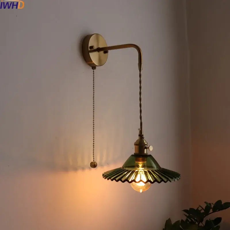 Antique brass wall lamp with green fluted glass shade and exposed bulb featuring pull chain by decorbites led wall