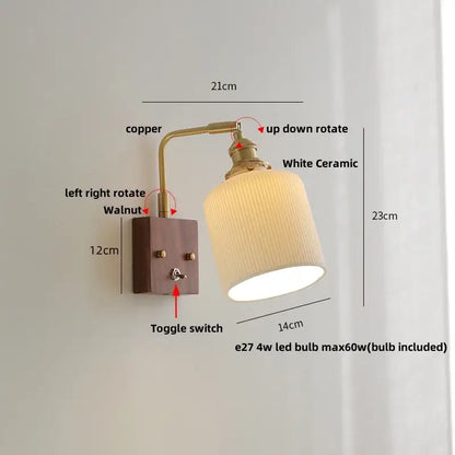 Antique brass and walnut wall lights with clear glass and copper arm featuring a walnut-mounted base and white ceramic shade