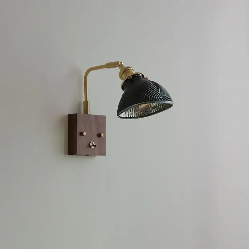 Black ceramic lamp with brass accents and wooden base complements antique brass and walnut clear glass wall lights stair fixture decorbites clear glass decor