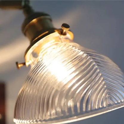 Antique brass and walnut clear glass wall lights with ribbed clear glass lampshade and brass hardware by decorbites clear glass
