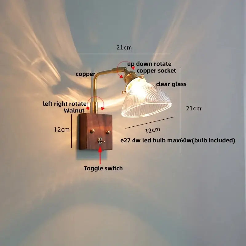 A rustic copper finished arm wall light with clear glass shade on walnut wood base for decorbites clear glass wall lights