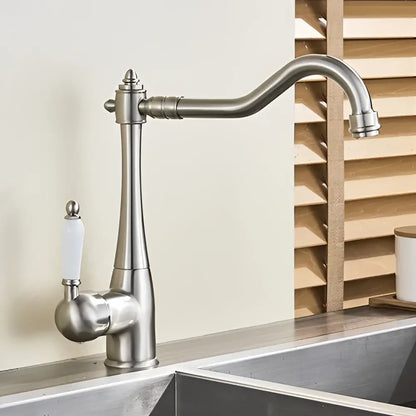 Stainless steel basin waterfall faucet with curved spout and white ceramic handle for kitchen use