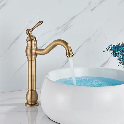 Antique brass basin faucet with single handle swivel spout featuring ornate detailing for bathroom use by decorbites brass basin