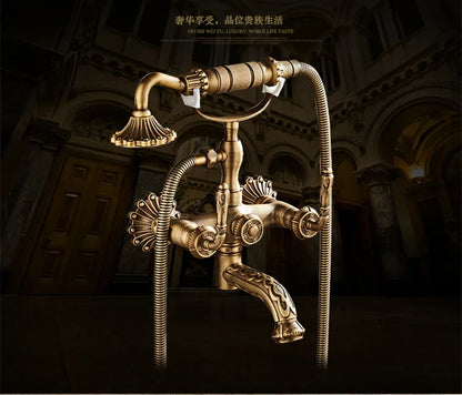 Antique brass bathtub shower set featuring vintage-style bathroom faucet with ornate fluted spout and decorative handles