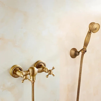Antique brass bidet mixer faucet set with ornate cross handles and matching handheld showerhead in brass finish