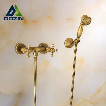 Antique brass bidet mixer faucet set with cross handles and matching handheld showerhead for bathroom use