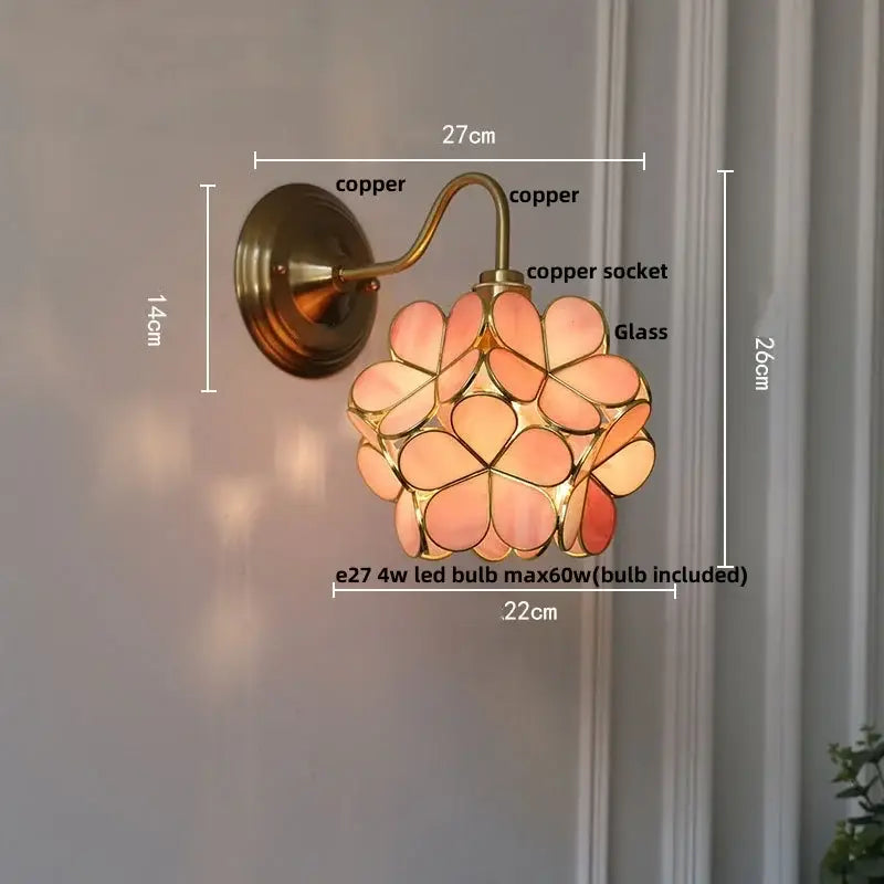 Antique brass blue flower glass led wall sconce with copper finish and peach-toned stained glass petals decorbites blue flower