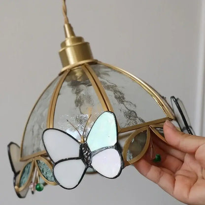Antique brass butterfly glass led wall lights featuring a delicate white and light blue butterfly pendant on a dome lampshade