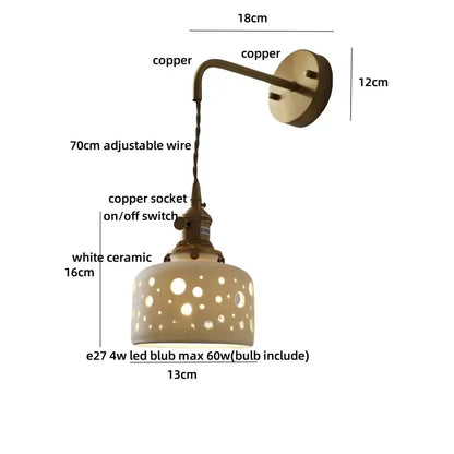 Antique brass ceramic led wall light with copper arm and white ceramic shade featuring circular cutouts decorbites ceramic led