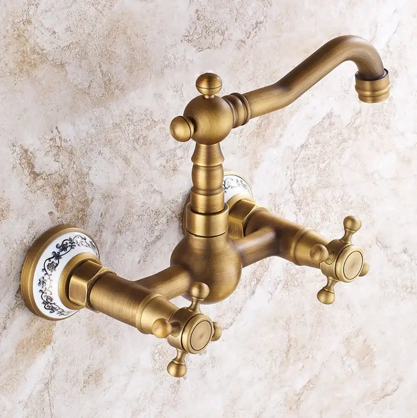 Antique brass ceramic wall mount kitchen faucet with ornate cross handles and decorative porcelain escutcheons by decorbites brass ceramic