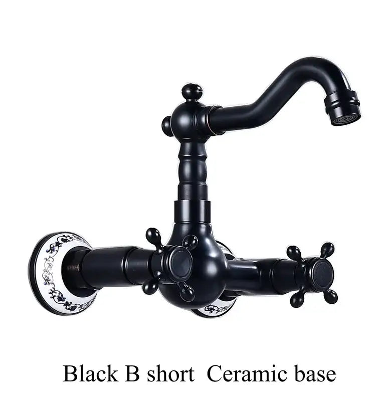 Antique brass ceramic wall kitchen faucet with black matte ceramic base ornate cross handles and decorative floral patterns