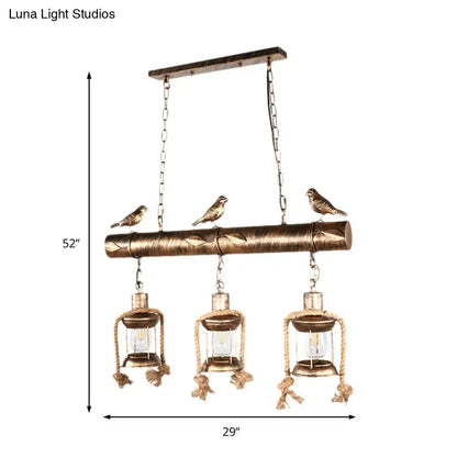 Decorbites antique brass lantern pendant with clear glass three-light chandelier featuring bulb bases and bird accents