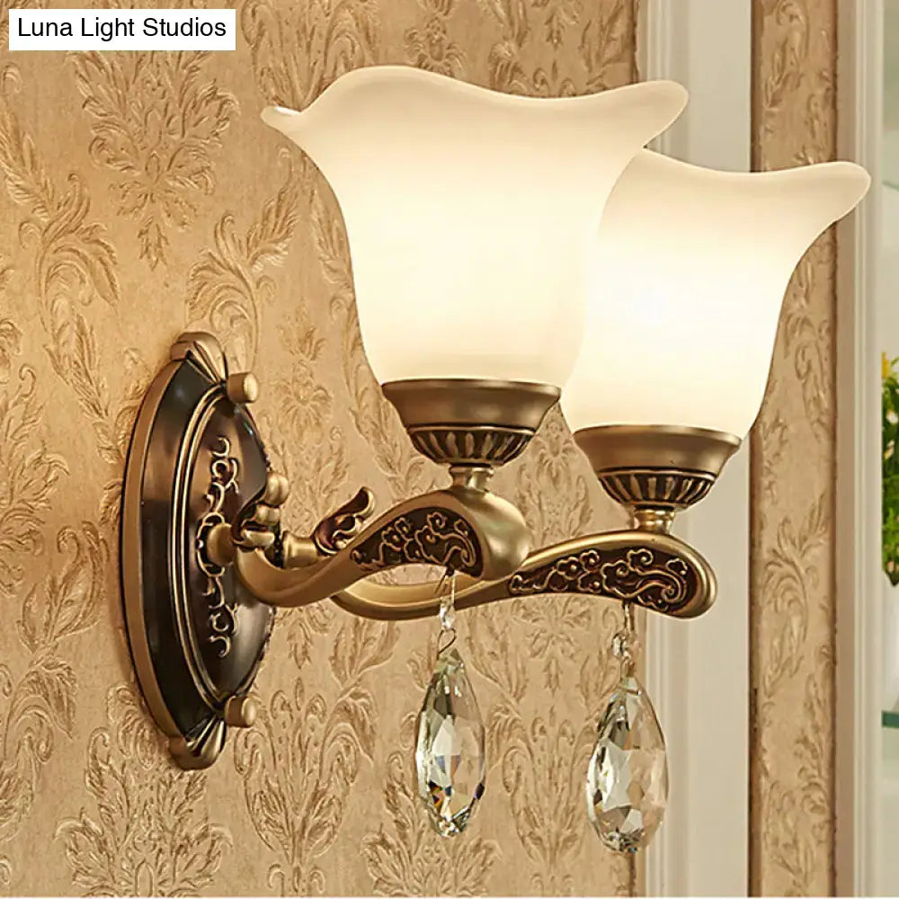 Antique brass two-light wall lamp with frosted glass shades and crystal drop pendants compatible with e12 e14 base