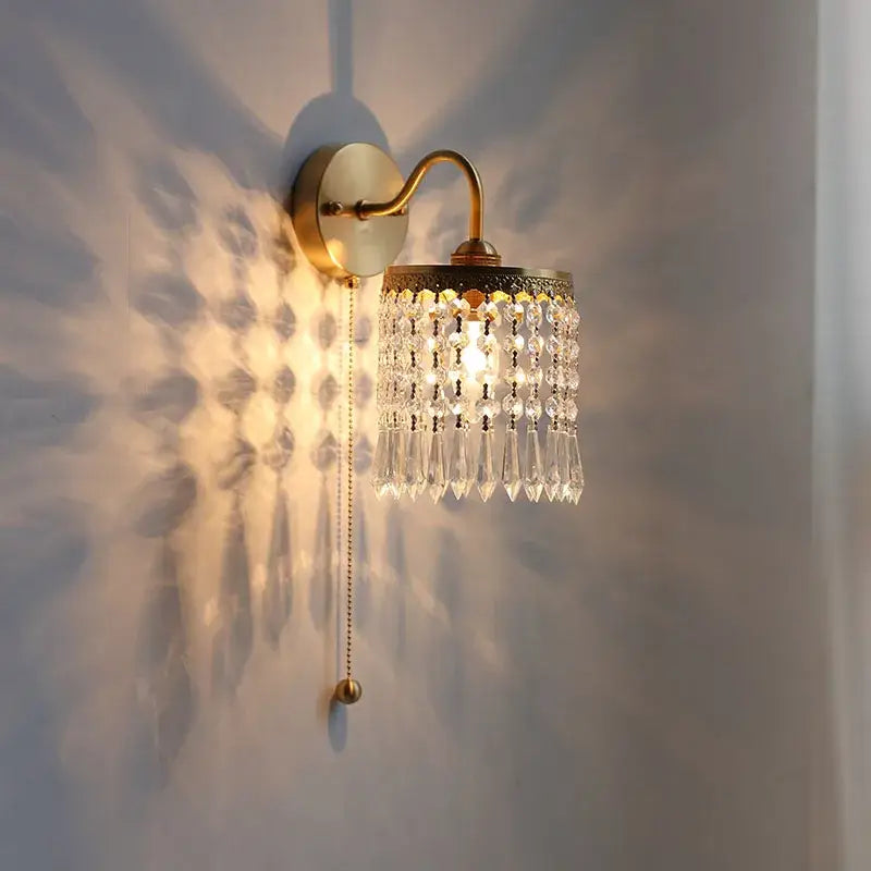 Antique brass crystal led wall sconce with cascading crystal droplets for elegant bedroom decorbites crystal led lighting