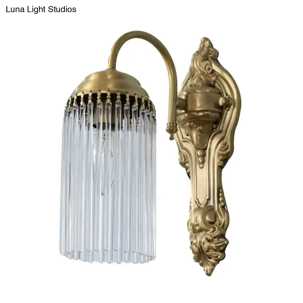 Antique brass crystal rod wall sconce featuring cascading clear glass prisms for ornate corridor lighting