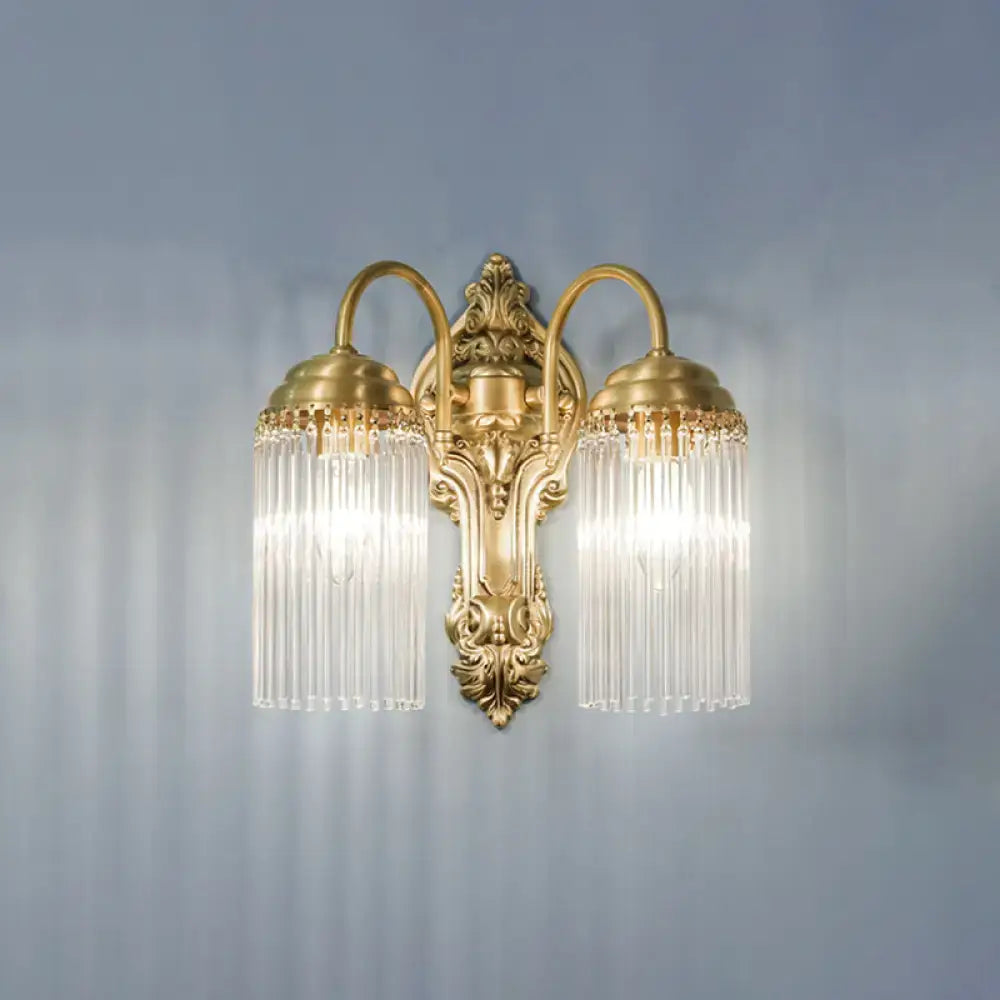 Antique brass crystal rod wall sconce with gold-toned two-arm design and cascading clear glass prisms for corridor lighting