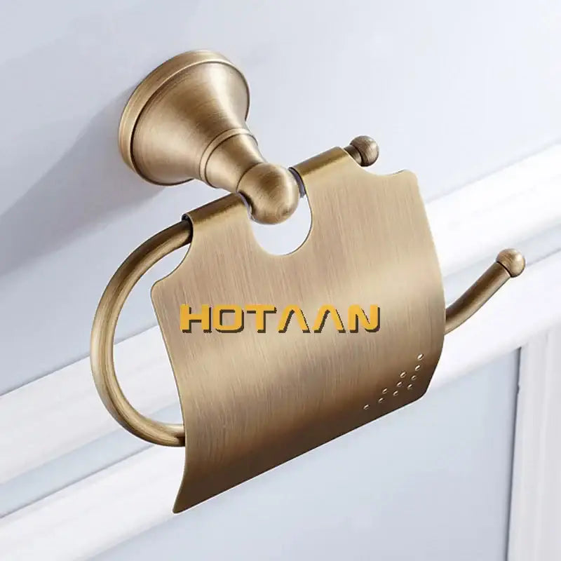 Antique brass curved toilet paper holder with a brushed metal surface and elegant design for bathroom use