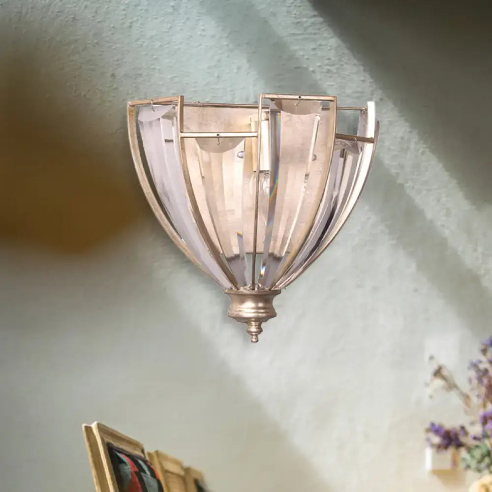 Antique brass curved wall sconce with ribbed translucent glass shade for bedroom lighting and decor