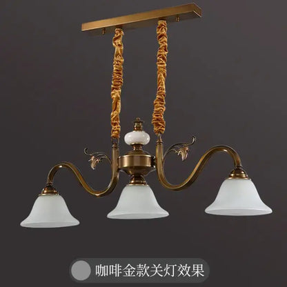 Antique brass decorbites coffee colored three headed pendant light with frosted shades and twisted rope-like chains