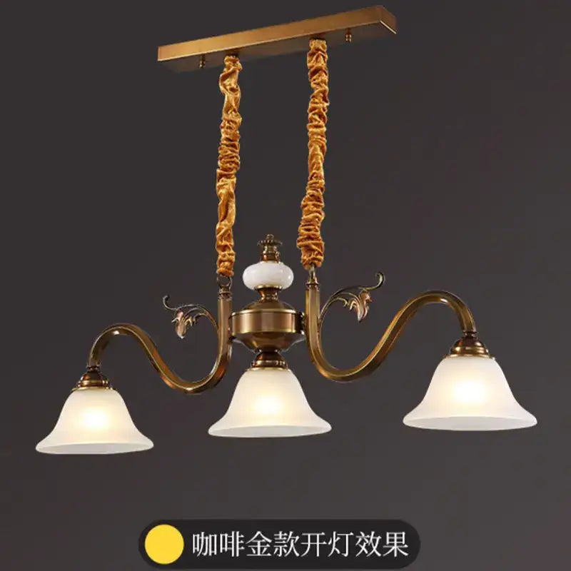Antique brass decorbites coffee colored pendant light with three frosted glass shades and twisted rope suspension cords