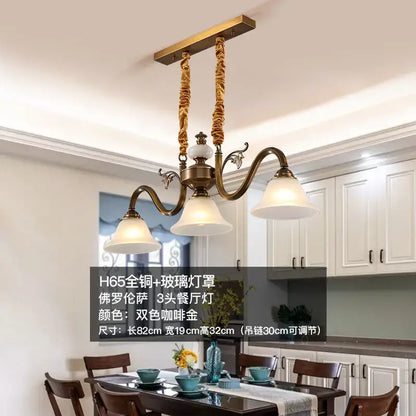 Antique brass decorbites coffee colored three headed pendant light with brass finish glass shades and twisted rope suspension
