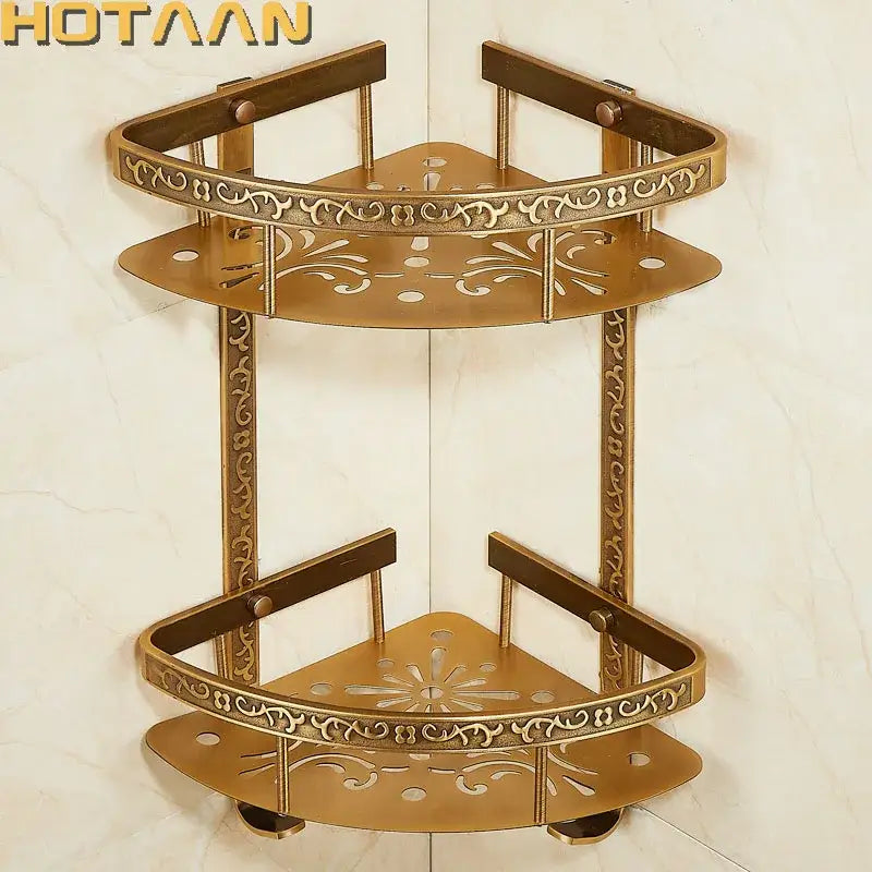 Brass-colored ornate double layer corner shelf with intricate floral cutouts decorbites antique aluminum bathroom rack