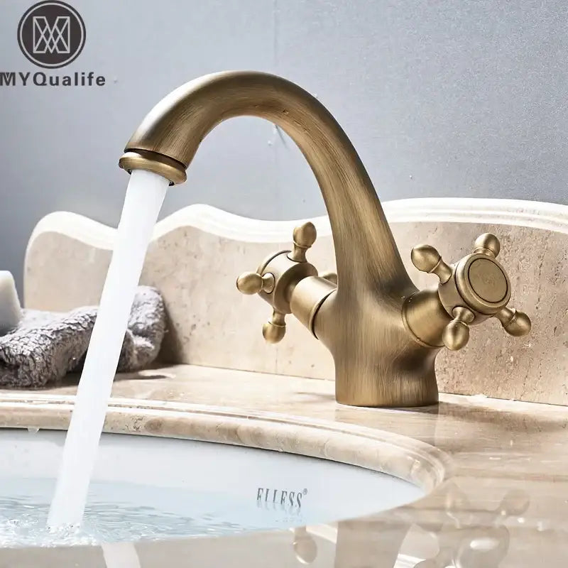 Antique brass basin faucet with dual ornate cross handles and curved spout for bathroom vanity decorbites dual handle