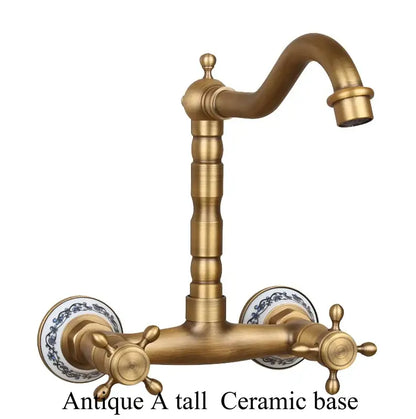 Antique brass dual handle kitchen faucet with hot water control and ornate porcelain plates with blue floral patterns