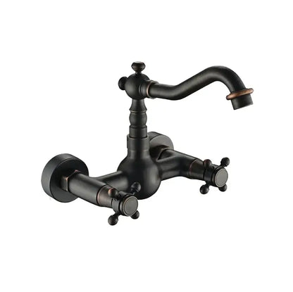 Antique brass dual handle kitchen faucet with black matte finish cross handles and curved spout for hot water use