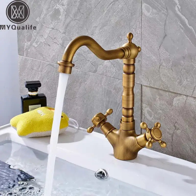 Antique brass decorbites dual handle swivel sink faucet with ornate segmented spout for kitchen use
