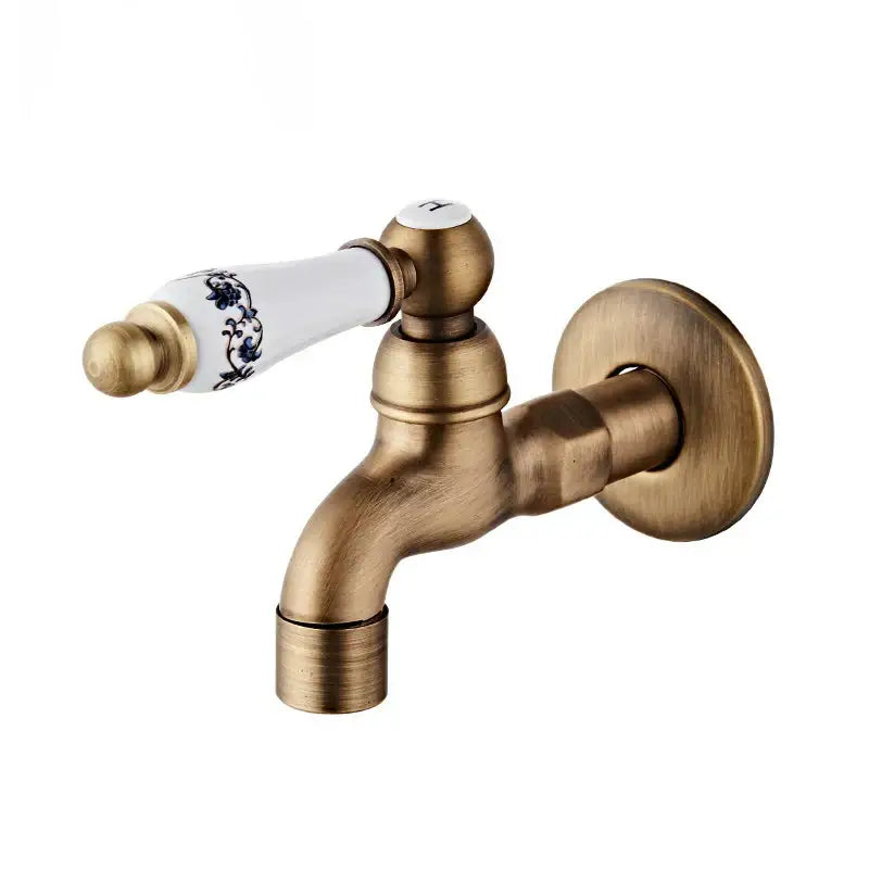 Antique brass floral ceramic wall mounted basin faucet with white ceramic handle featuring blue floral patterns
