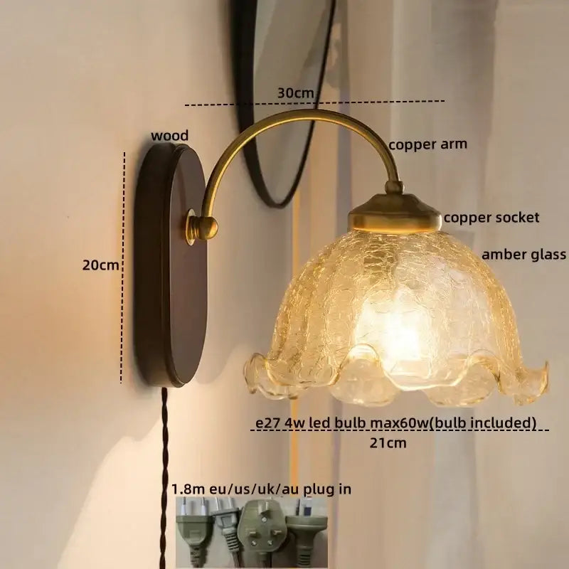 Antique brass led wall light with textured amber glass shade and wooden backplate for bedroom sconce lighting