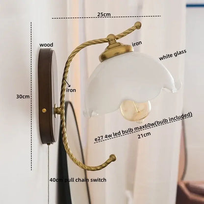 Antique brass floral led wall lights with frosted glass lampshade and wooden backplate for bedroom wall sconce