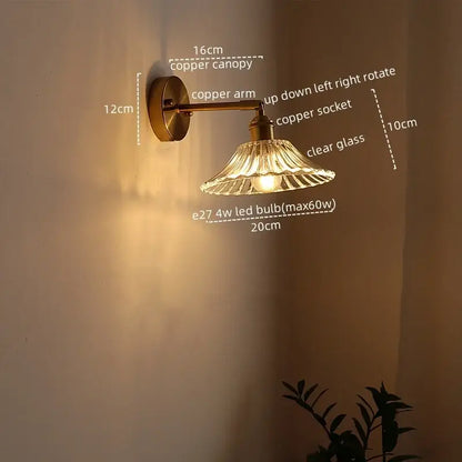 Copper-finished antique brass flower glass sconce led wall lamp with clear fluted shade and adjustable arm for bedroom