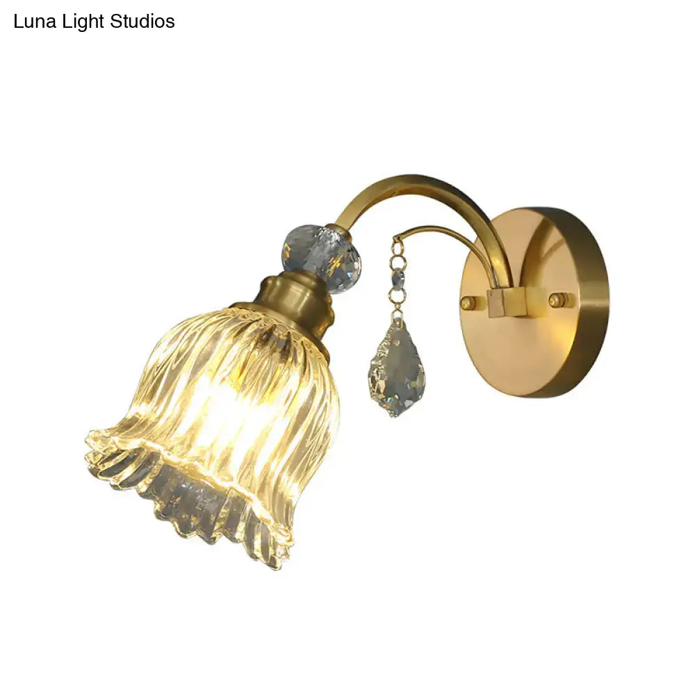 Antique brass flower wall sconce with gold-toned ribbed glass shade and crystal accents for living room wall lighting