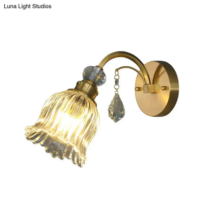 Antique brass flower wall sconce with gold-toned ribbed glass shade and crystal accents for living room wall lighting