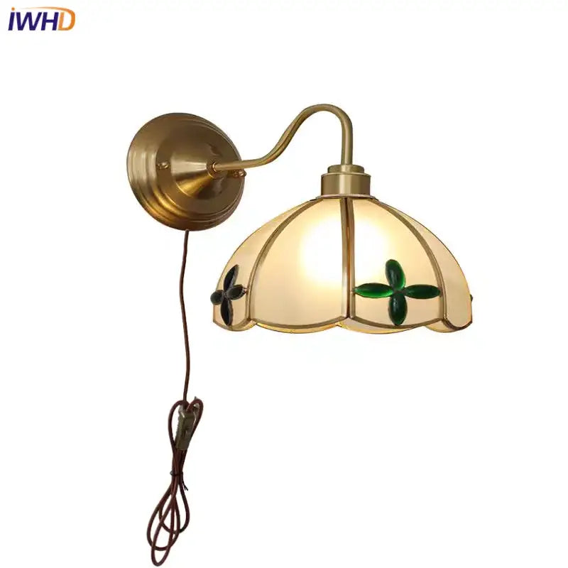 Antique brass glass brass wall sconce with cream glass shade featuring green clover motifs for dining room decorbites wall fixture