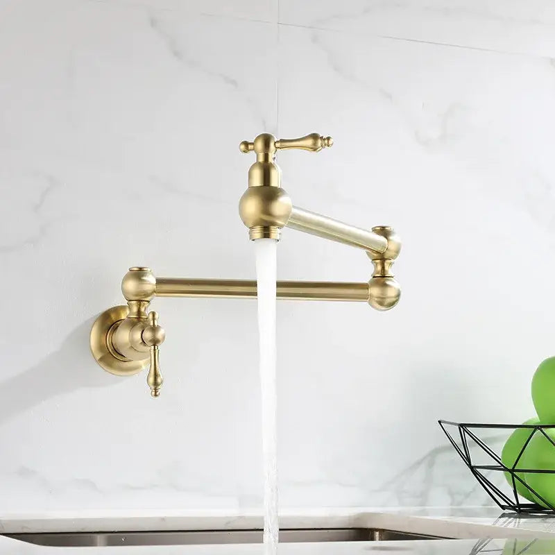 Antique brass gooseneck pot filler tap with ornate handles and sleek curved spout for kitchen wall mounting