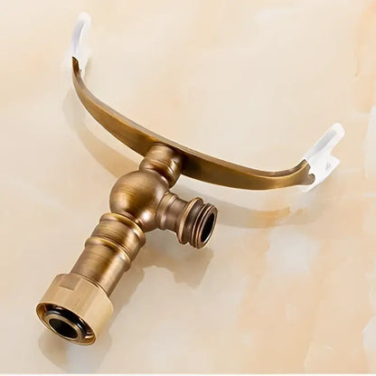 Antique brass hand shower holder hook with arched design and two threaded outlets for bathroom pedestal bracket