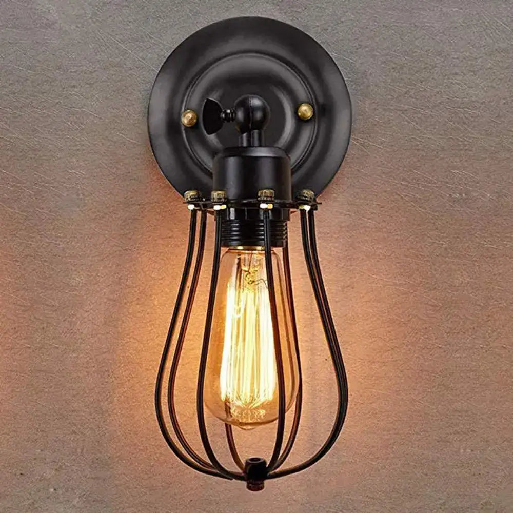 Black wrought iron industrial wall lamp with vintage edison bulb and wire cage decorbites industrial wall sconce