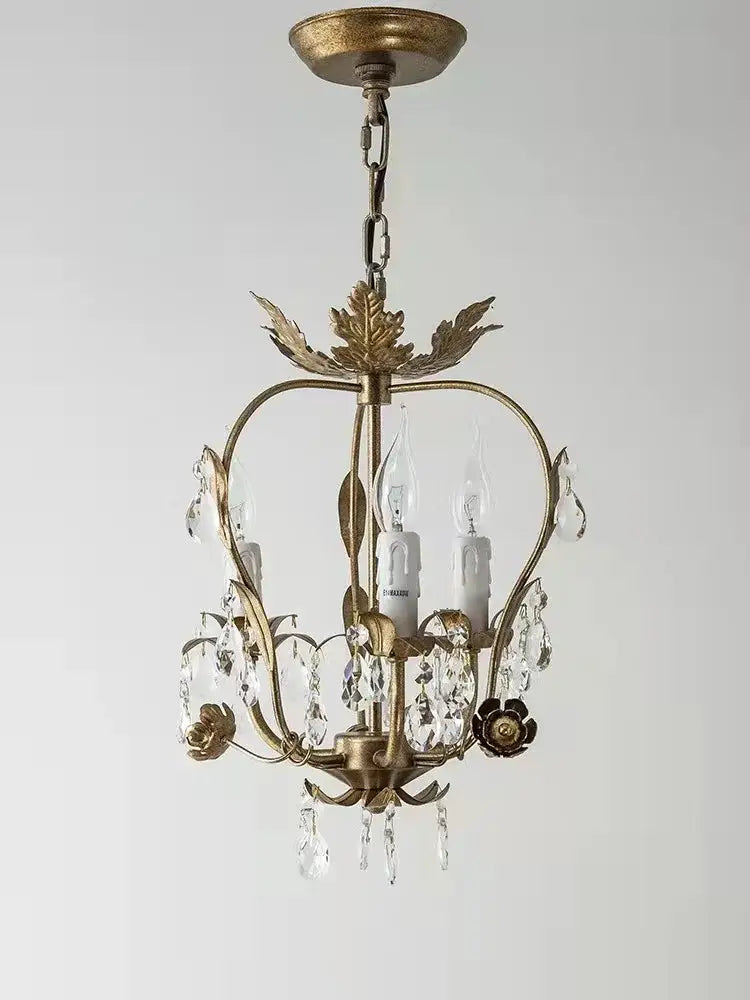 Antique brass iron crystal chandelier with crystal droplets and leaf motifs from decorbites iron crystal collection