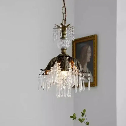 Antique brass leaf crystal pendant light featuring cascading clear crystal droplets in a brass pendant chandelier design