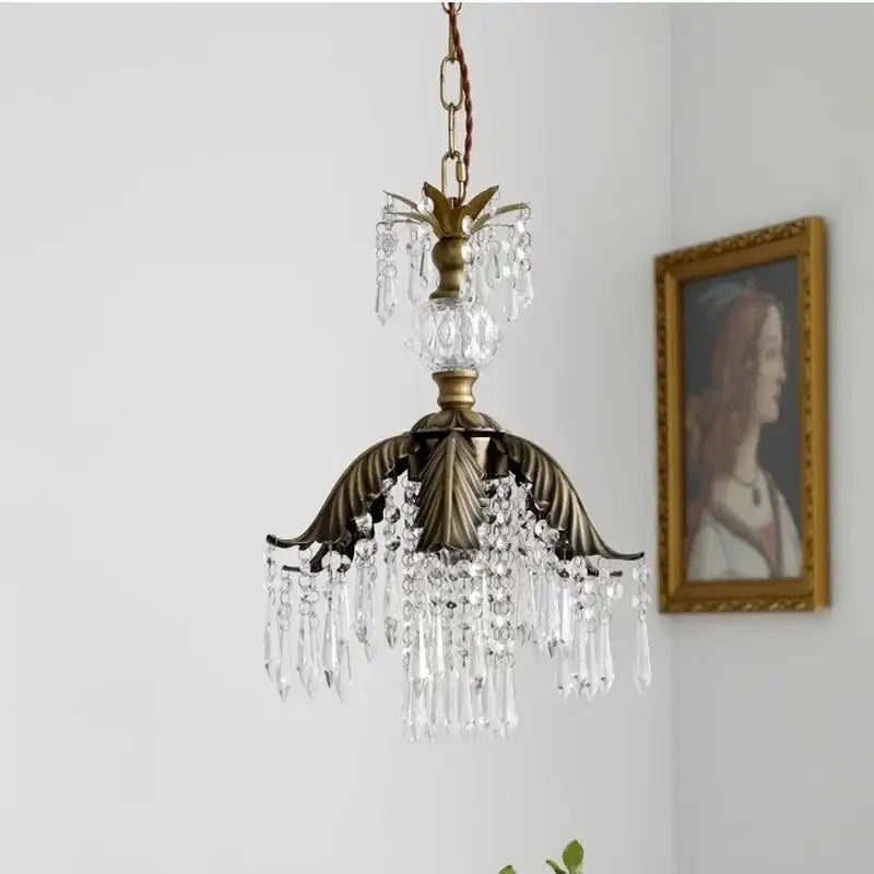 Antique brass leaf crystal pendant light featuring fluted metal base and clear crystal droplets for elegant decorbites brass pendant chandelier