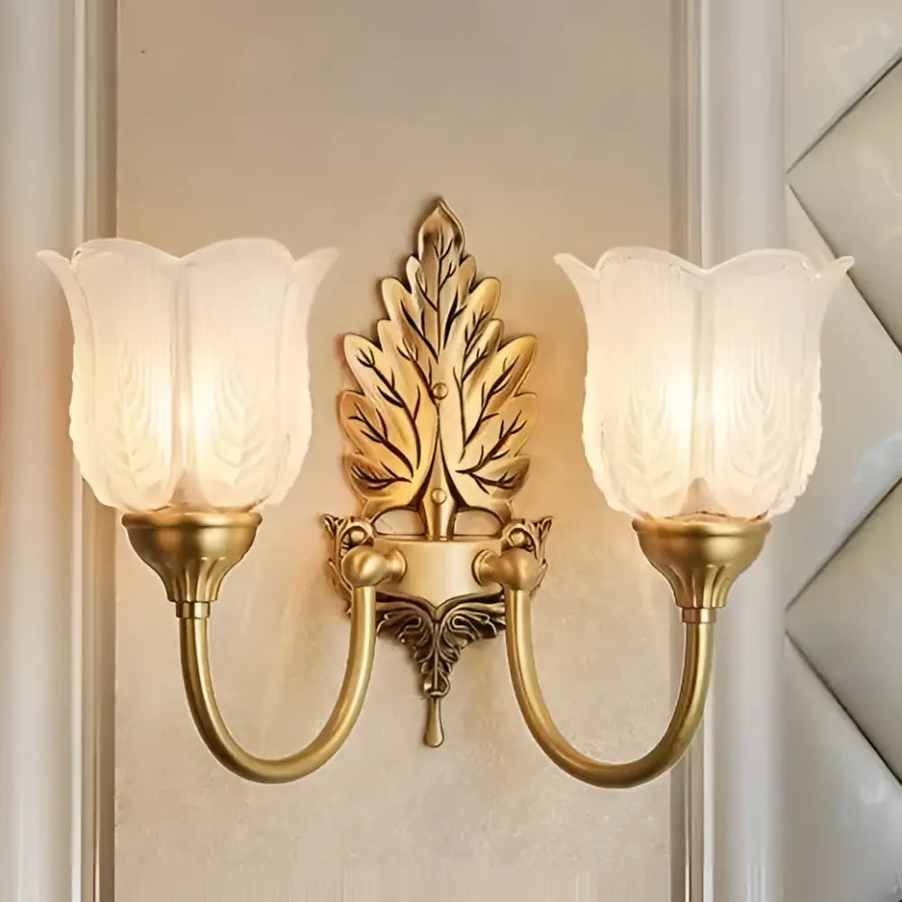 Antique brass leaf tulip wall lamp with frosted glass shades perfect as a decorbites brass wall lamp for bedroom decor