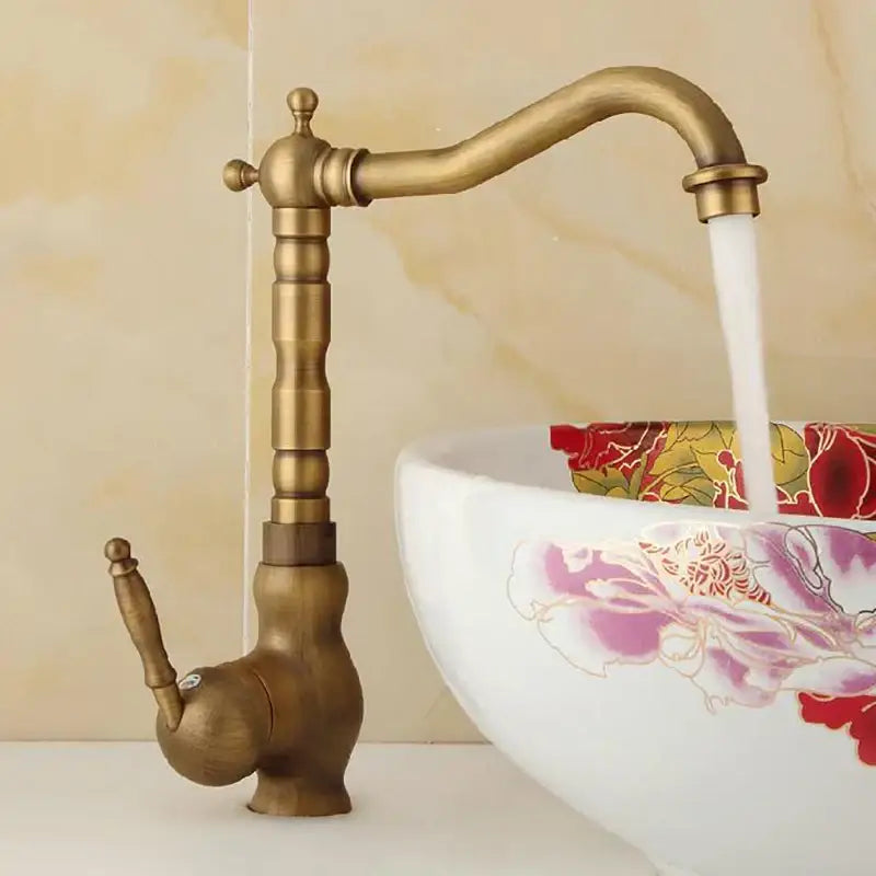 Antique brass decorbites basin sink faucet with single handle curved spout and decorative knob for bathroom use