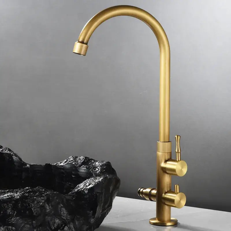 Antique brass outdoor faucet with dual control knobs and sleek curved spout in decorbites brass outdoor finish